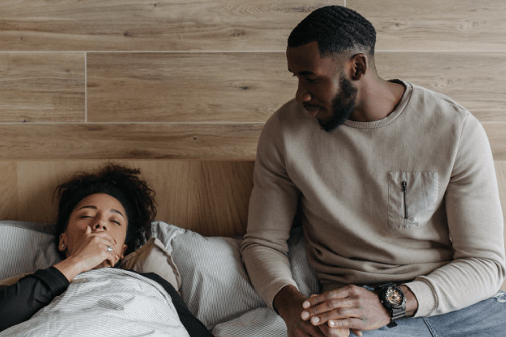 Husband taking care of his sick wife